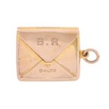 A George V 9ct gold envelope novelty postage stamp case, engraved with the initials B.R., 23 x 27mm,
