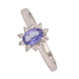 A tanzanite and diamond cluster ring, in platinum, Birmingham 2007, 3.7g, size L, certificate Good