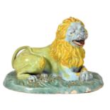 A Northern European tin glazed earthenware model of a lion, late 18th c, painted predominantly in
