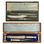 Two late Victorian EPNS and antler or bone hafted carving sets, cased, that in oak case with brass