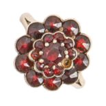 A garnet cluster ring, in gold coloured metal marked 800, 3g, size K Good condition