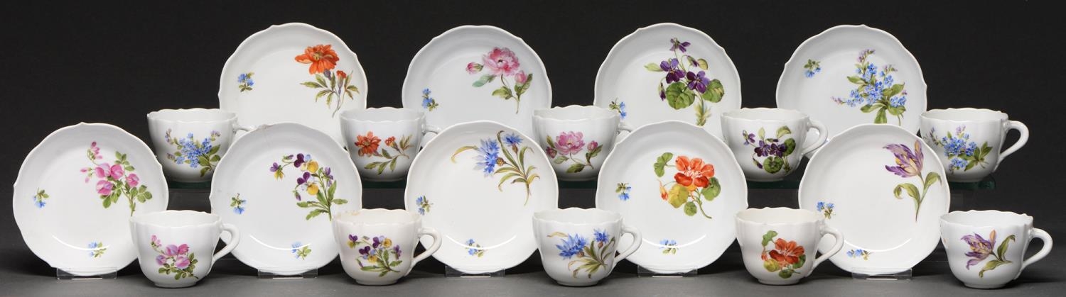 A set of ten Meissen coffee cups and eleven saucers, 20th c, painted with flowers, saucer 10.5cm