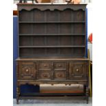 A stained oak dresser and boarded rack, early 20th c, 206cm h; 49 x 153cm