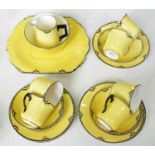 A Beswick & Son yellow ground bone china tea service, c1925-1930, moulded plate 25.5cm over handles,