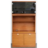 A teak wall unit, c. 1970, glazed cabinet above a shelf and a niche, cupboard base, 178cm h; 47 x