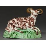 A Staffordshire earthenware model of a horned sheep, c1800-10, decorated in manganese and green