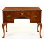 A walnut and feather banded low boy, late 19th c, the quarter veneered top with ovolo lip and fitted