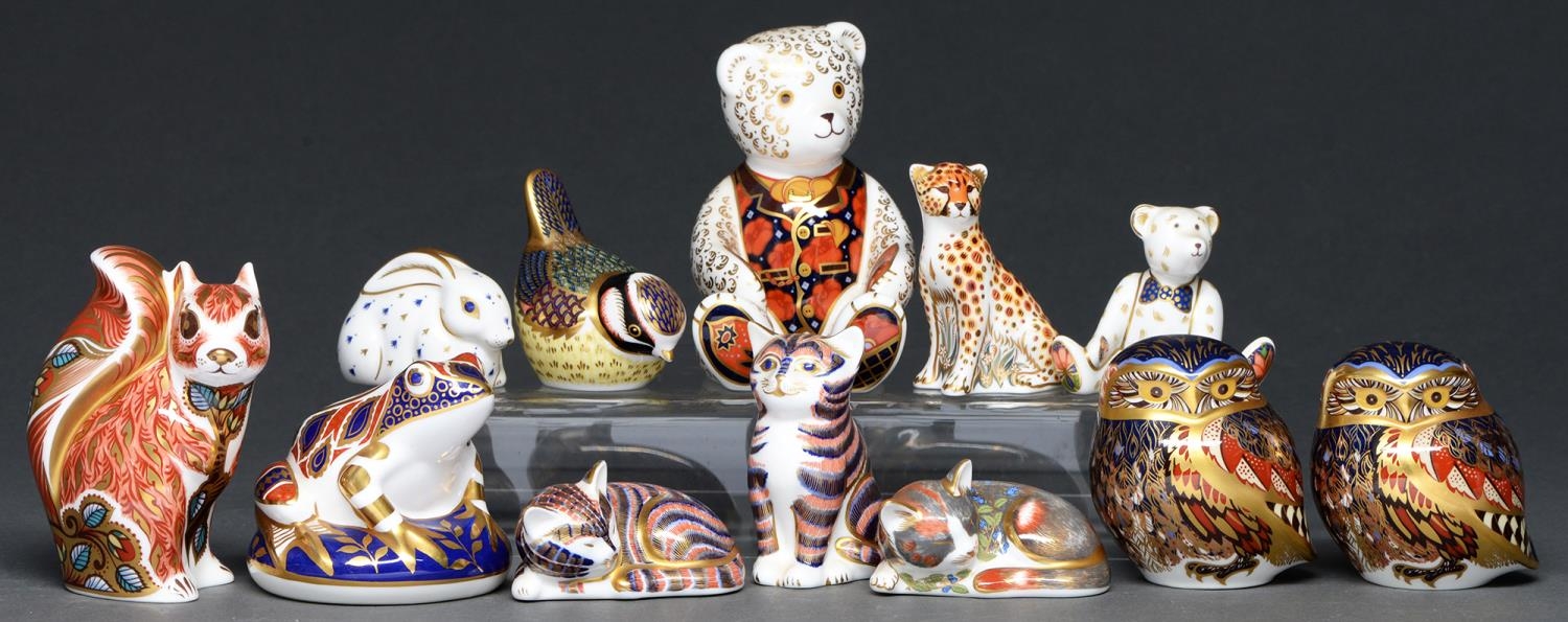 Twelve Royal Crown Derby paperweights, various sizes, printed marks and stopper All in good