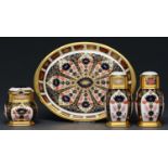 A Royal Crown Derby Imari pattern condiment set and oval tray, late 20th c, tray 19.5cm l (5) Good