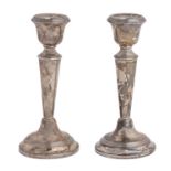 A pair of George V silver candlesticks, 16cm h, marks rubbed, Birmingham 1923, loaded Slight dents