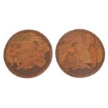 A pair of round marquetry and pokerwork medallions, 19th c, of Venus and Cupid and Cupid
