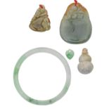 A jade bangle and thee other items