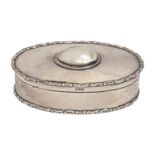 An Edwardian oval silver trinket box, the lid inset with mother of pearl, 10cm l, by Cohen &