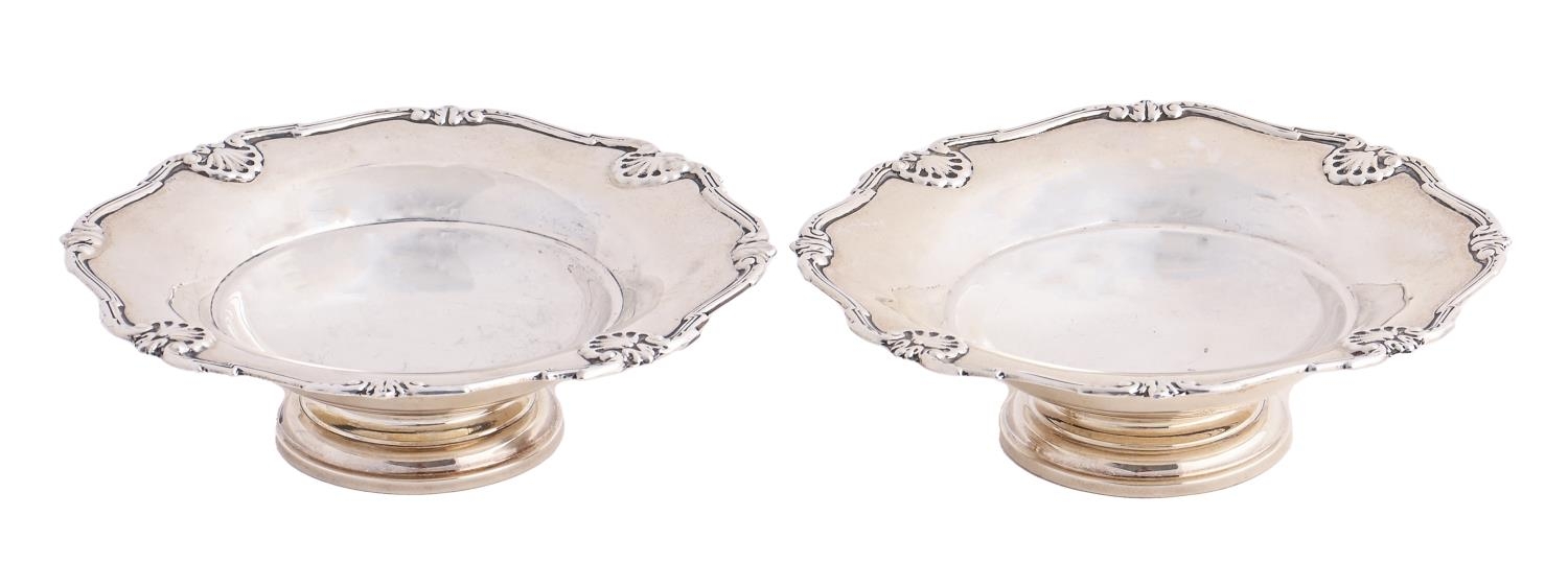 A pair of George VI silver bonbon dishes, shaped and reeded shell borders, circular pedestal