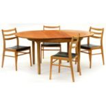 A teak extending dining table, c. 1970, circular top, tapering reeded legs, 75cm h; 122cm diam, with