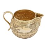 A Victorian silver gilt cream jug, chased with bands of foliage, 60mm h, markers mark rubbed, London