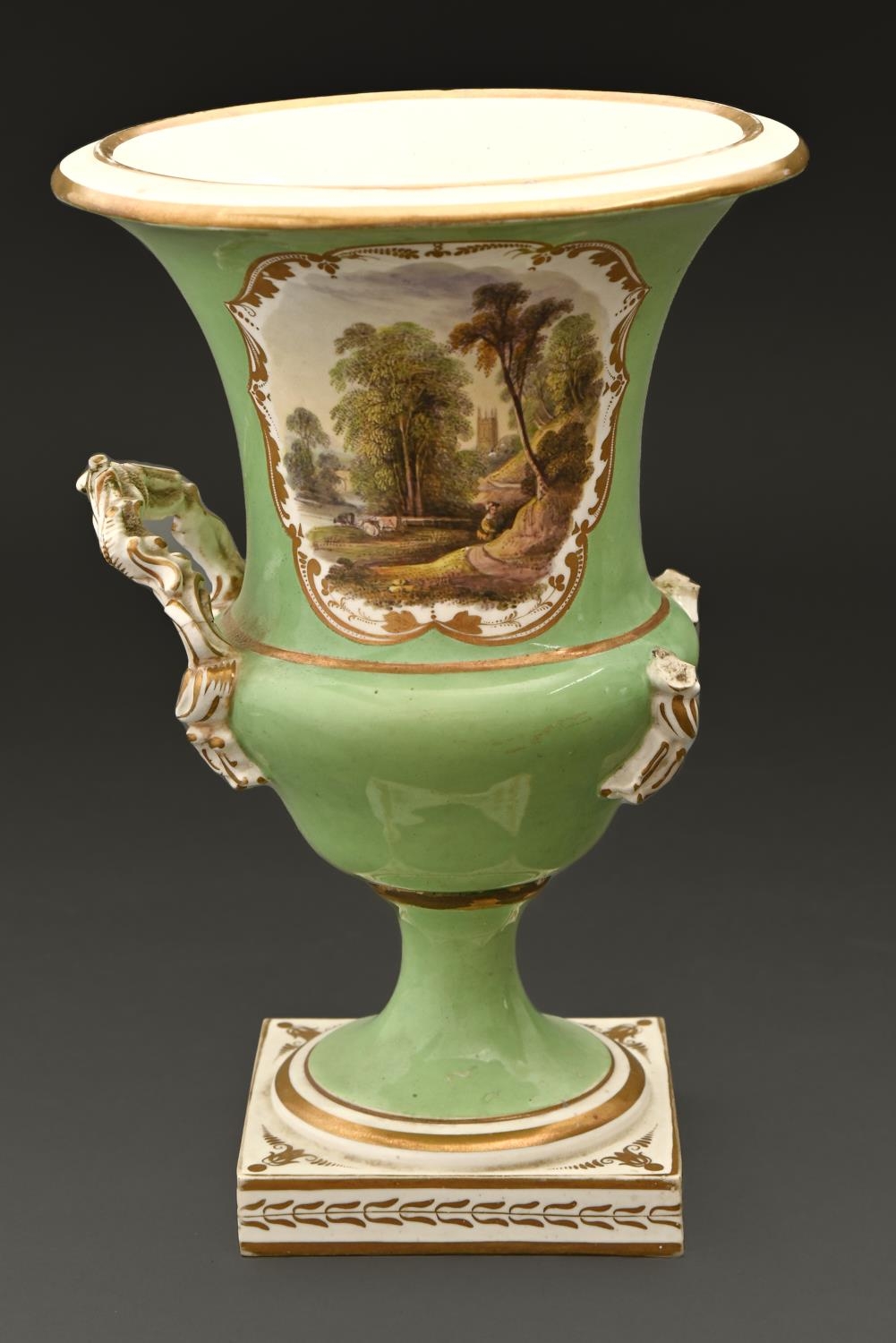 A Derby vase, c1830, of campana shape, painted with a landscape reserved on an apple green ground,