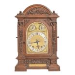 A German carved oak bracket clock, c1890, with Winterhalder & Hofmeier movement striking on two