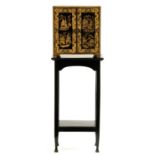 A Chinese black and gold export lacquer table cabinet, early 19th c, the interior fitted with