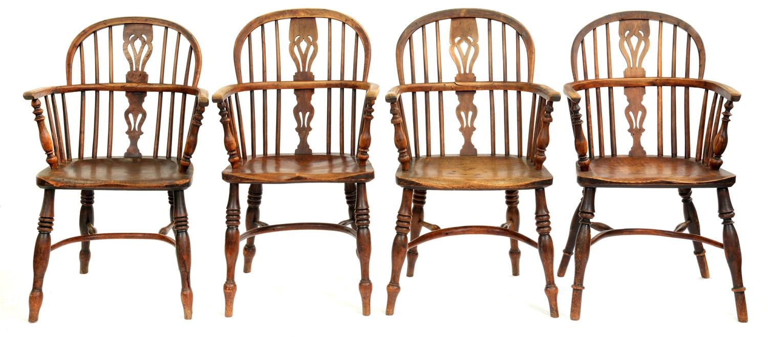 Four Victorian yew wood Windsor chairs, East Midlands Region, with crinoline stretcher, three with