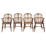 Four Victorian yew wood Windsor chairs, East Midlands Region, with crinoline stretcher, three with