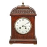 A mahogany basket-topped mantle clock, early 20th c, with enamel dial and French gong striking