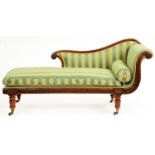 A George IV mahogany chaise longue, with moulded frame on reeded legs and brass castors, matching