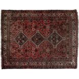 A Persian medallion carpet, 20th c, red ground, 196 x 166cm Good condition. Bold colours. Some