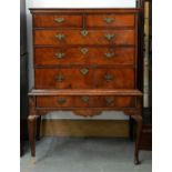 A George II walnut and crossbanded chest on stand, 144cm h; 56 x 98cm Side of chest damaged, handles