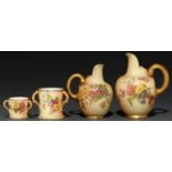 Two graduated Royal Worcester flat-back jugs and two loving cups, early 20th c, decorated with