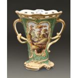 A Staffordshire bone china flared vase, moulded to either side with C and S-scroll reserves