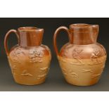 Two English saltglazed brown stoneware hunting jugs, second quarter 19th c, with sprigged