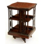An Edwardian serpentine mahogany and inlaid rotating bookcase, 82cm h; 53 x 53cm Top slightly