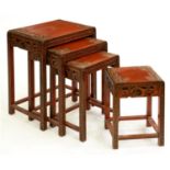 A Chinese carved nest of four tables, second quarter 20th c, 66cm h; 35.5 x 51.5cm Water stains to