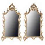 A pair of rococo style silvered wood mirrors, late 20th c, 133 x 66cm Good condition