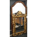 A carved and pierced giltwood and composition mirror, 98 x 63cm and two others with mahogany frames