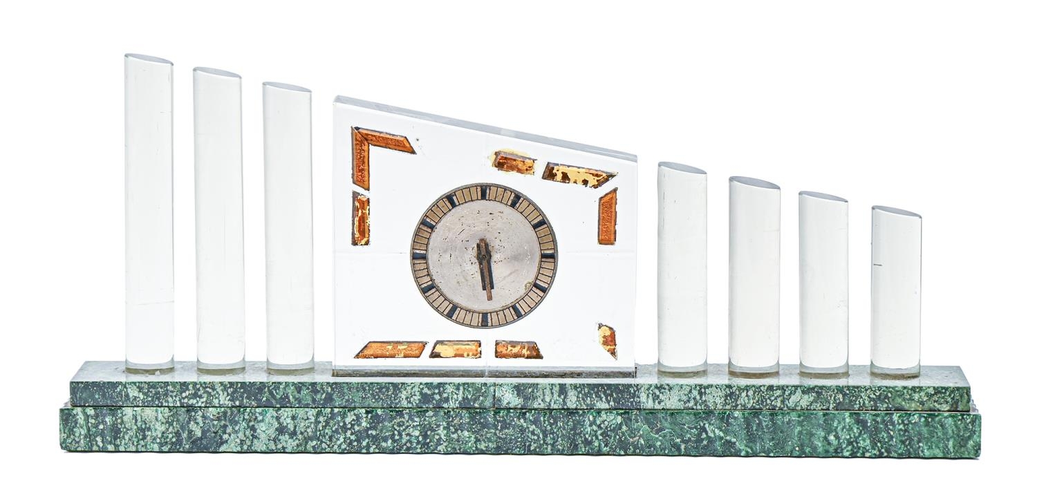 An Art Deco glass mantle timepiece, c1930, on porphyry base, 46cm w Some decoration to clock face