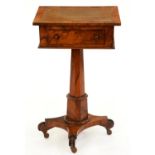 A Victorian walnut pedestal writing table, with adjustable top, drawer and ink drawer, on