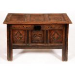 An oak chest, late 17th c, with three panel lid, those to the front carved with lozenges or flower