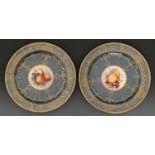 A pair of Royal Worcester dessert plates, 1922, painted to the centre by R Sebright, both signed,
