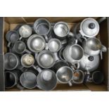 A quantity of Victorian and later pewter tankards, etc