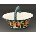 A Wemyss ware basket, c1900, painted with apples, 29cm l, impressed mark and printed oval mark of