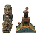 Two painted cast iron mechanical banks - Paddy and the Pig and Magician Bank, 18 and 20cm h