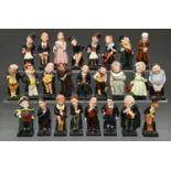 Charles Dickens. Twenty-five Royal Doulton bone china figures of Dickens' characters, each on square