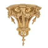 A Regency giltwood and composition wall bracket, 45cm h; 45cm l Some chips, losses and old repairs