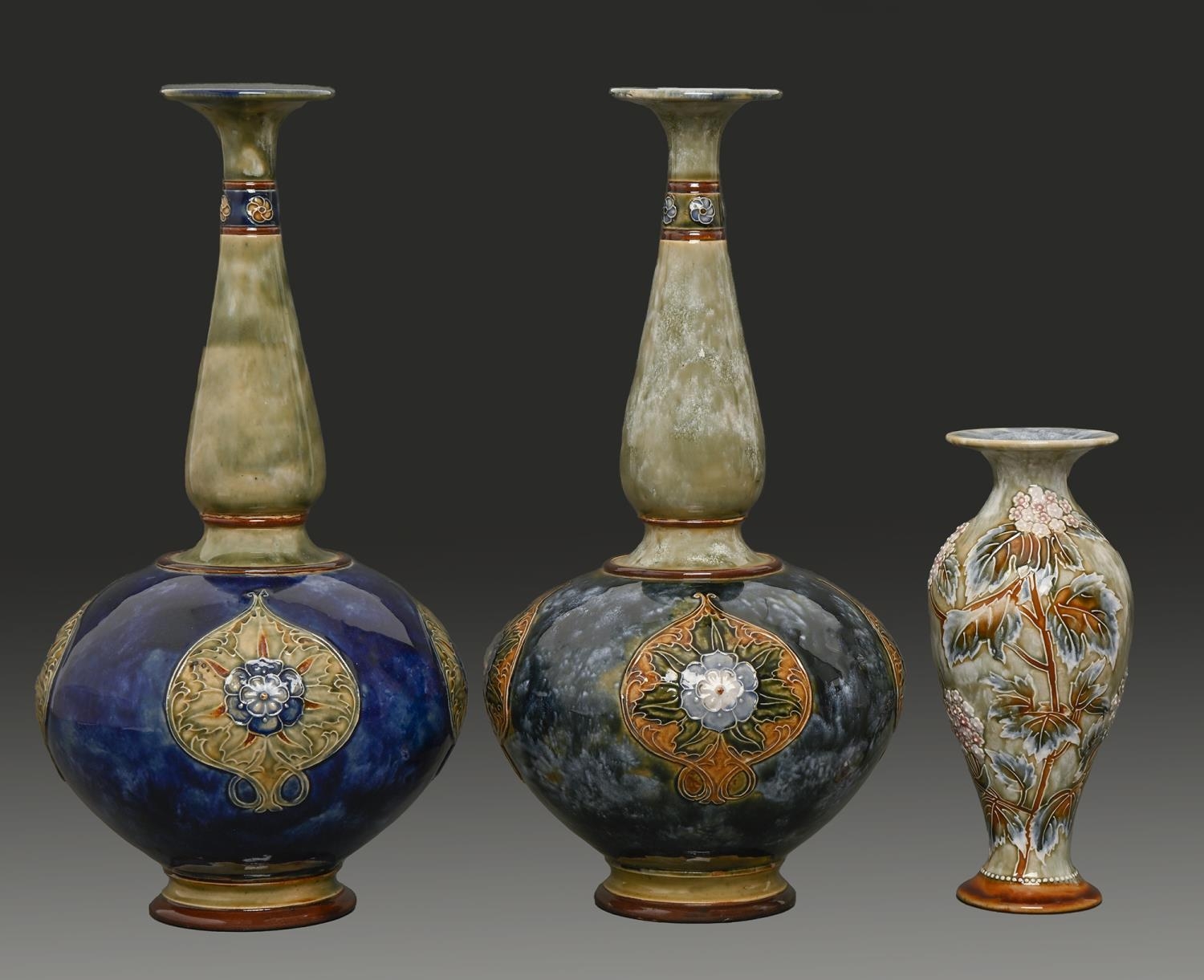 Three Doulton Ware vases, early 20th c, one decorated by Florence E Roberts with applied flowers and