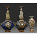 Three Doulton Ware vases, early 20th c, one decorated by Florence E Roberts with applied flowers and