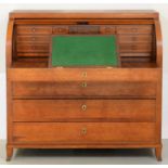 A Northern European oak cylinder bureau, c1800, the fitted interior with sliding front and