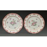 A pair of Chinese export porcelain octagonal famille rose plates, c1780, painted with flowers in red