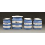 Four T G Green & Co Cornish kitchenware storage jars and two covers, 17.5cm h and smaller, printed